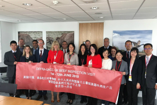 the UK CVO and Chinese GACC officals standing in a room with a